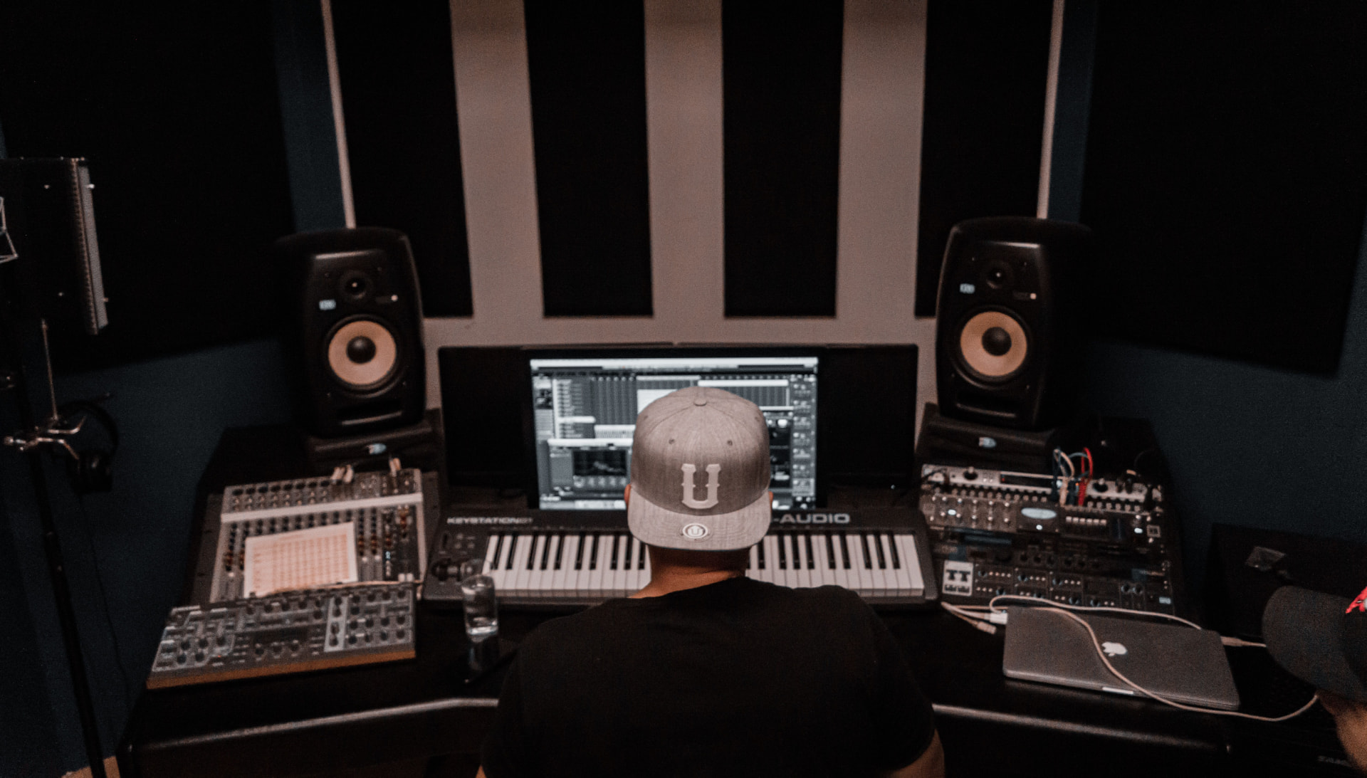 Producer working at a home studio desk