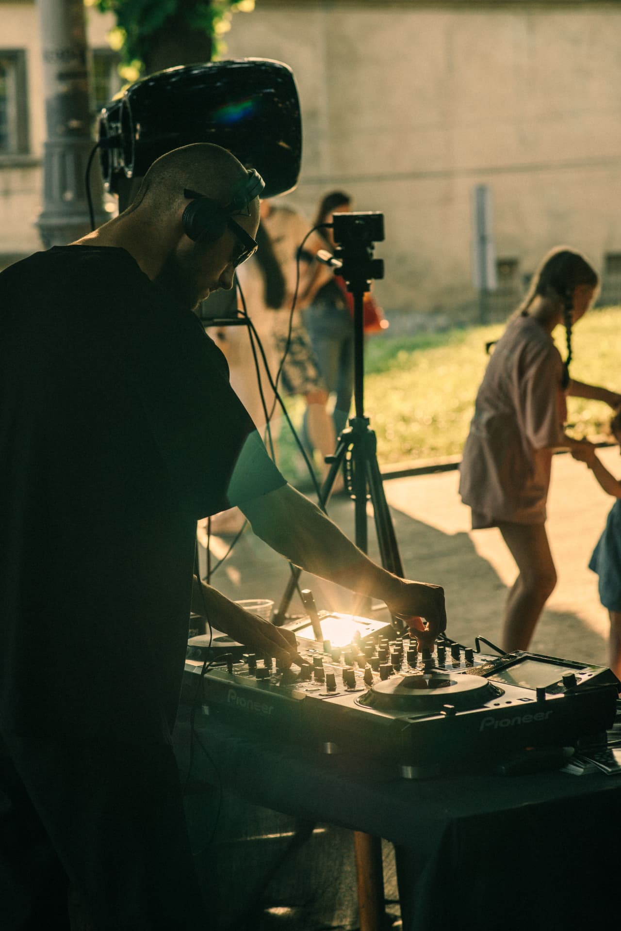 DJ mixing on Pioneer decks at an outdoor set