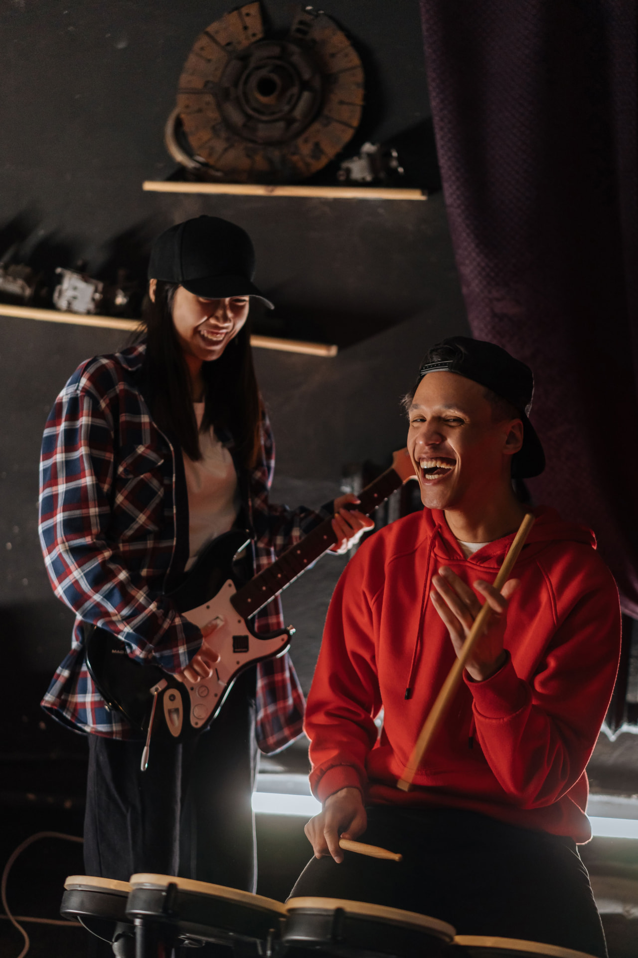 Two musicians laughing during a rehearsal